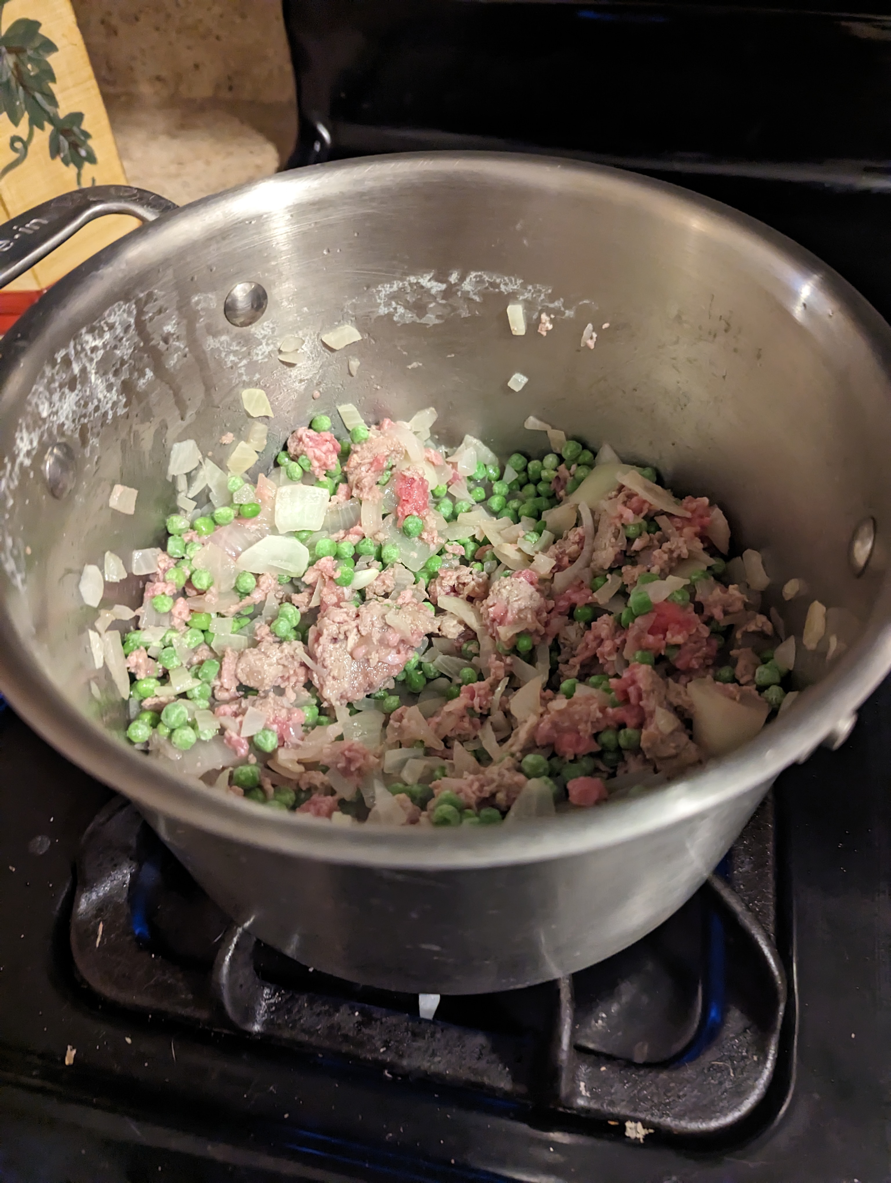 adding the beef and peas.